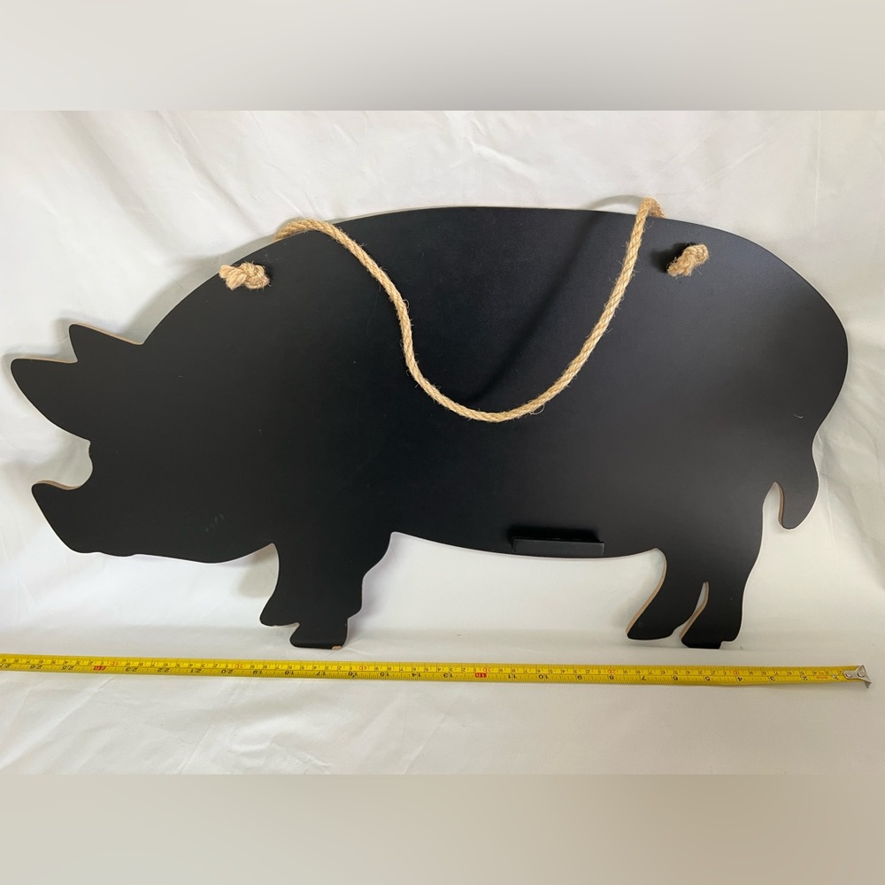 farmhouse-style pig-shaped chalkboard sign with rope to hang on wall